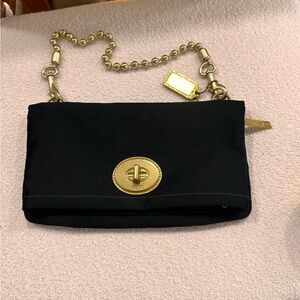 Coach Vintage Clutch Bag. THIS IS NOT LEATHER!  This is a black satin bag.